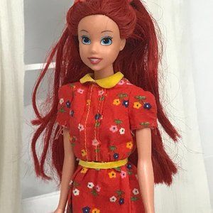 Ariel disney princess doll wearing red dress